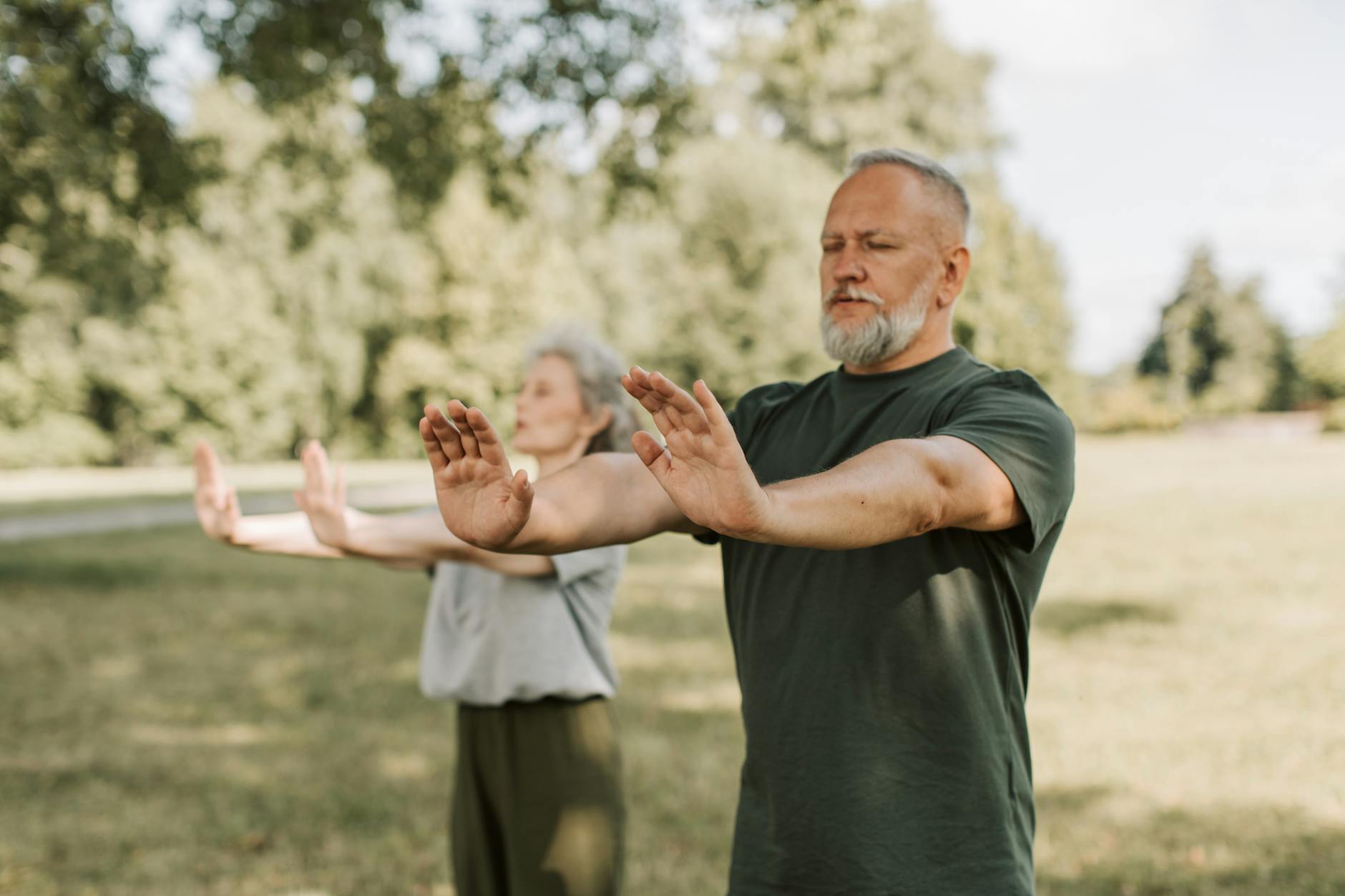 Free Things to Do in Hanoi: 30+ Budget Activities (2026) 2 Elderly couple engaged in outdoor Tai Chi promoting wellness