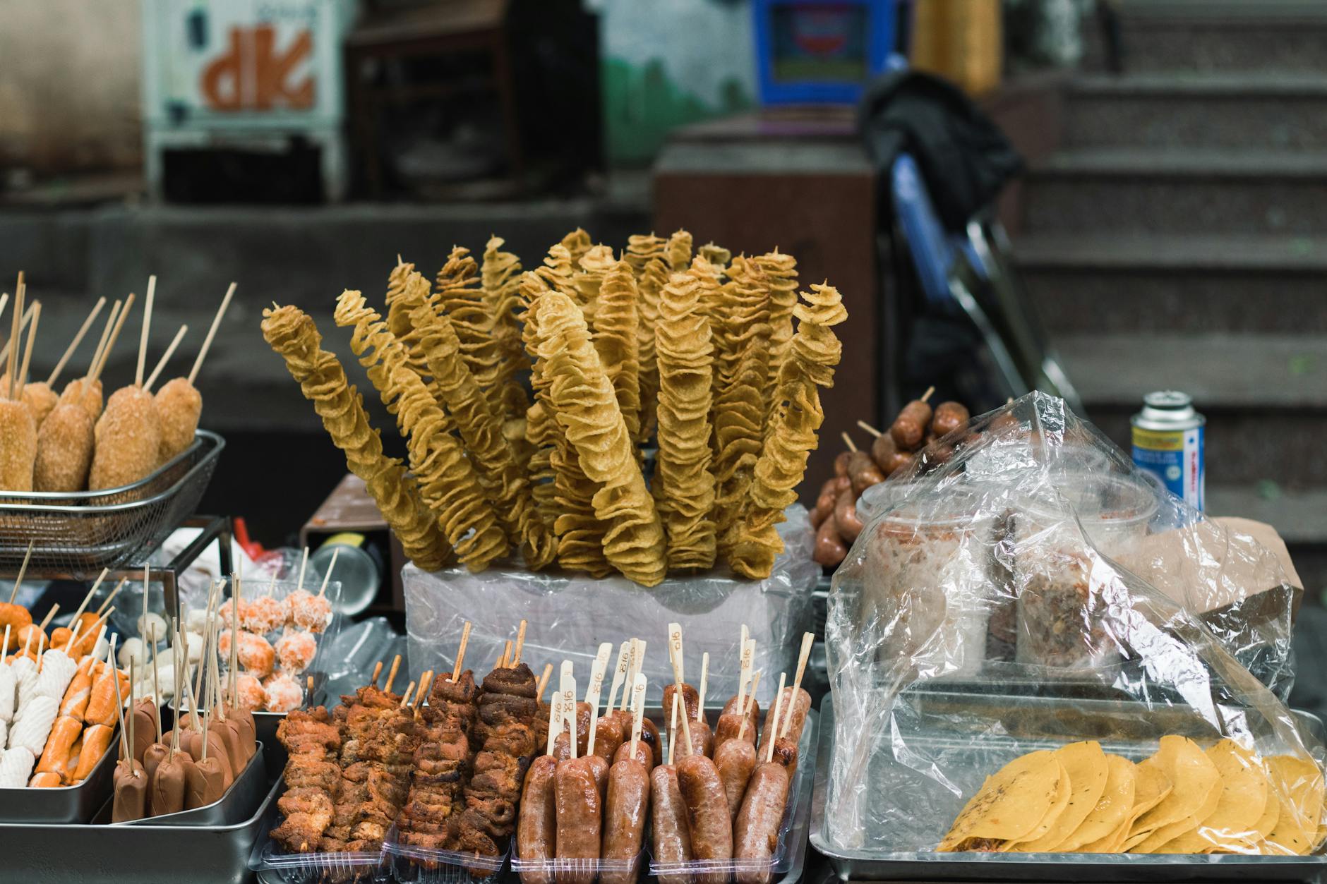 Assorted Vietnamese street food at an outdoor Hanoi market stall