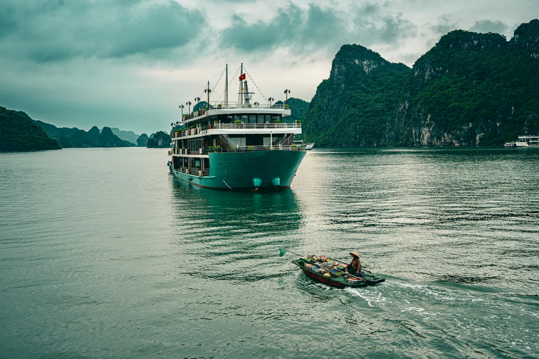 Majestic cruise boat sailing through emerald waters of Halong Bay