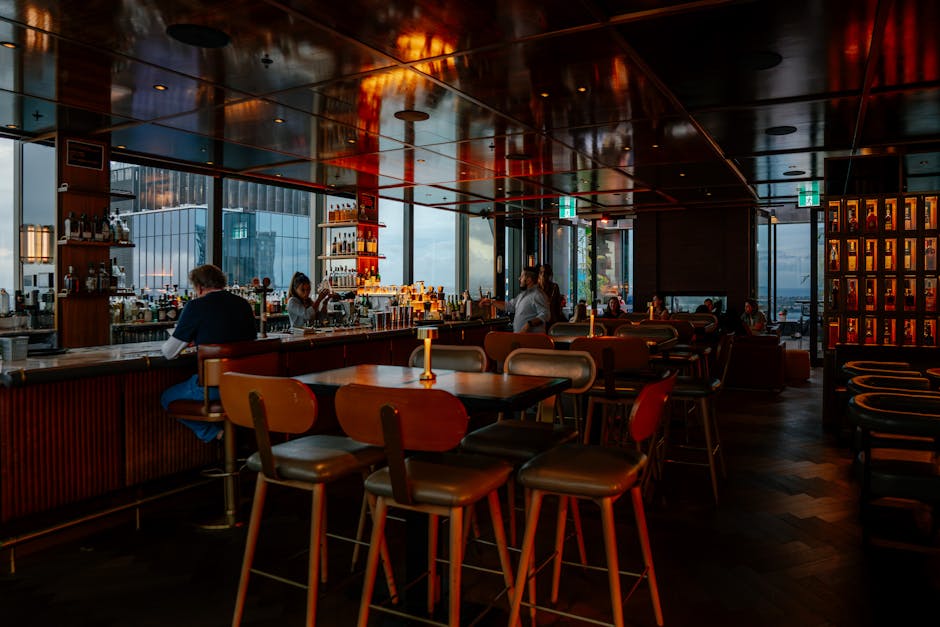 Best Bars in Hanoi: Top Picks & Venues (2026) 1 Warm rooftop bar interior
