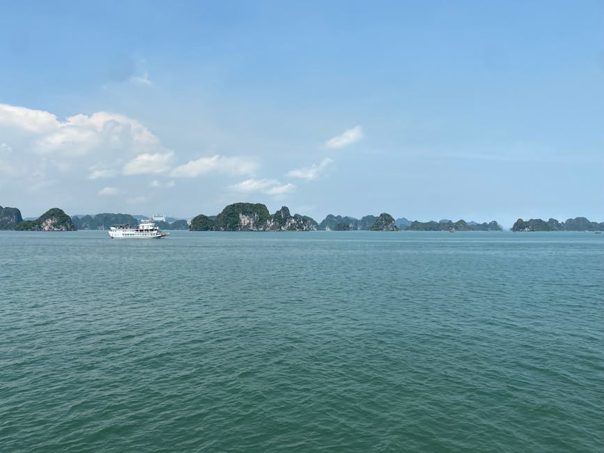 Ha Long Bay islands and boat aerial view