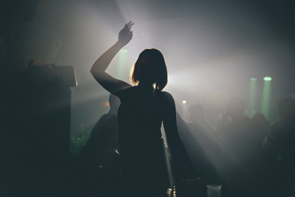 Hanoi Clubs & Lounges: Dance & Party Scene (2026) 2 Woman silhouette enjoying nightclub