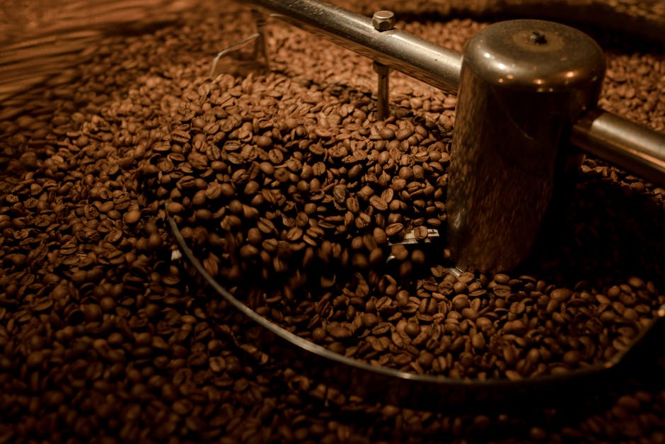 Hanoi Coffee Beans: Buy & Bring Home (2026) 2 Coffee beans being roasted industrially