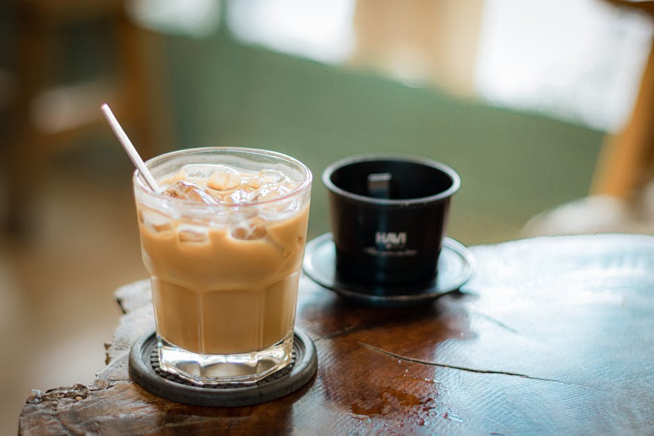 Vietnamese Coffee Types: Varieties Explained (2026) 2 Glass of iced coffee and phin filter