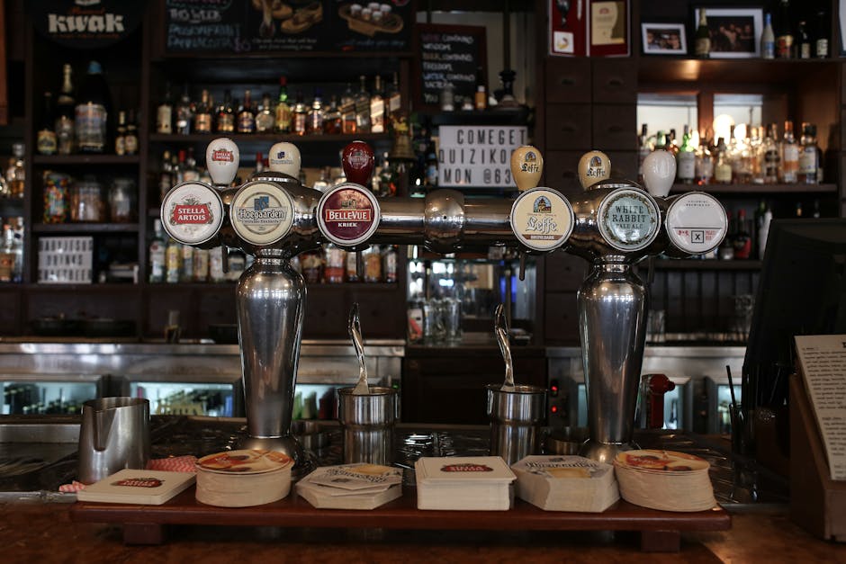 Hanoi Craft Beer Scene: Breweries & Bars (2026) 2 Beer taps showcasing popular brands in pub