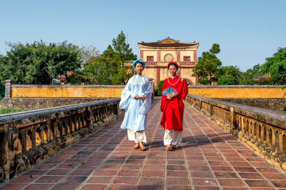 Hanoi Culture & History: Complete Heritage Guide (2026) 4 Vietnamese women in traditional ao dai clothing