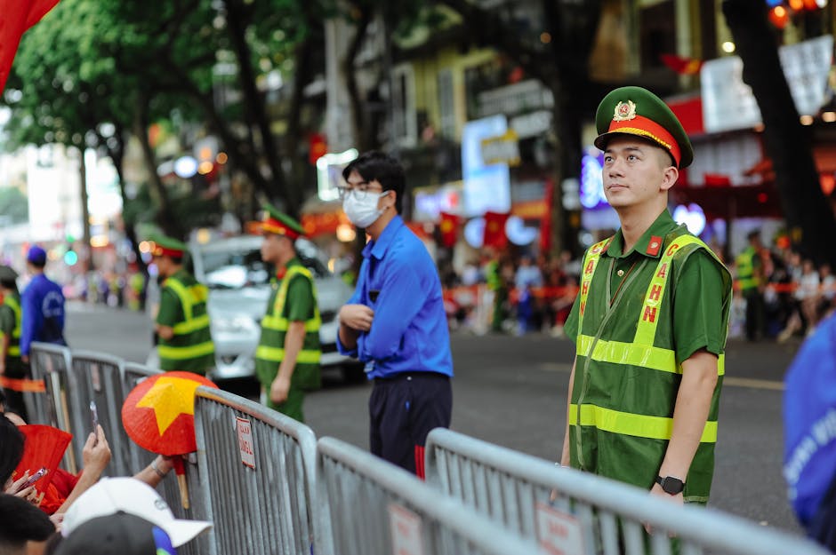 Hanoi Emergency Contacts: Important Numbers (2026) 2 Vietnamese police officers managing crowd