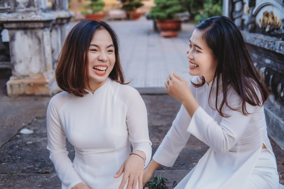 Vietnamese Customs & Etiquette: Cultural Guide (2026) 2 Two Vietnamese women in traditional attire laughing