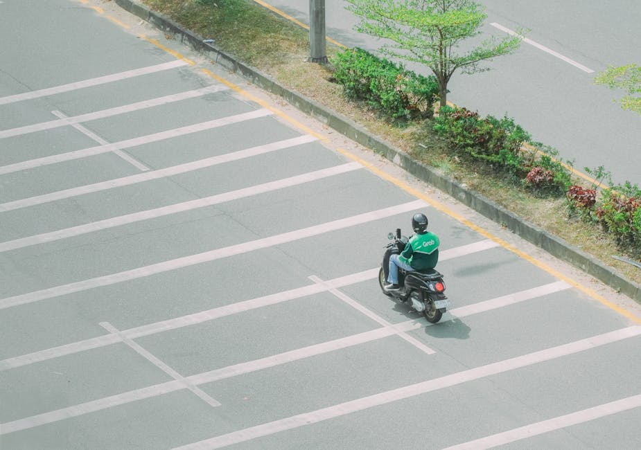 Grab Taxi Hanoi Guide: Booking, Costs & Tips (2026) 2 Grab motorbike rider on quiet Vietnam street