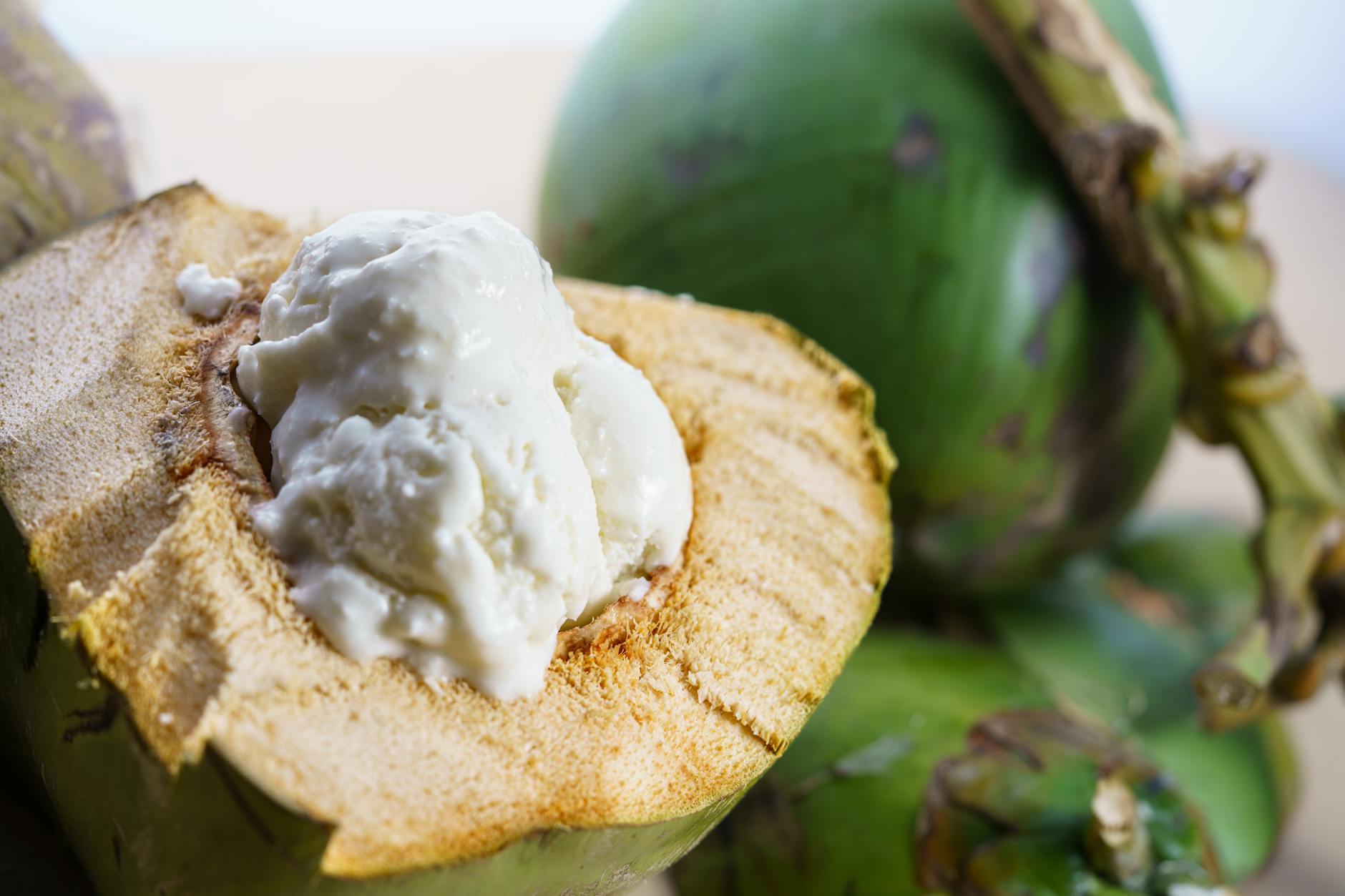 Hanoi Desserts & Sweets: 20 Best Treats & Cafes (2026) 4 Creamy coconut ice cream served in a green coconut shell