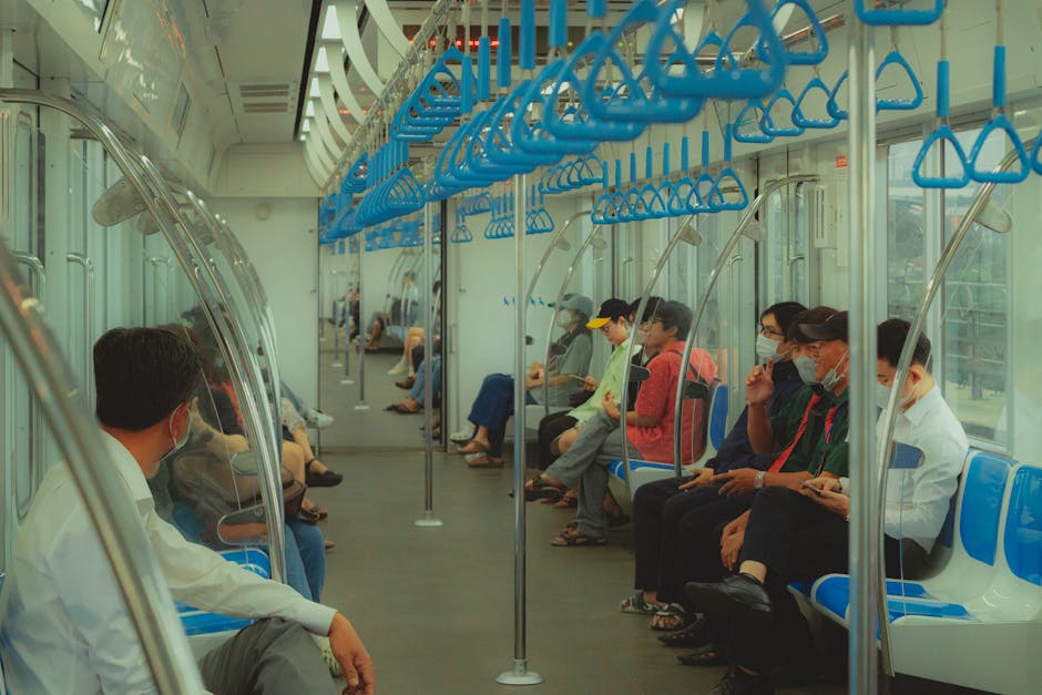 Hanoi Metro Guide: Lines, Stations & Fares (2026) 3 Passengers on a modern metro train in Vietnam