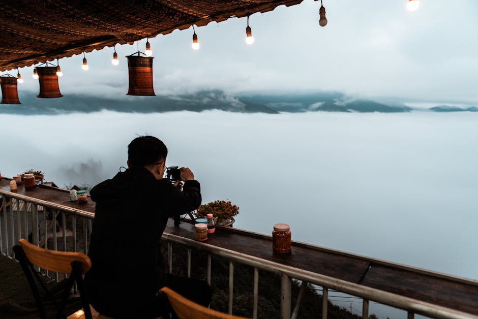 Hanoi Photography Itinerary: Top Photo Spots (2026) 1 Photographer with camera in Vietnam landscape