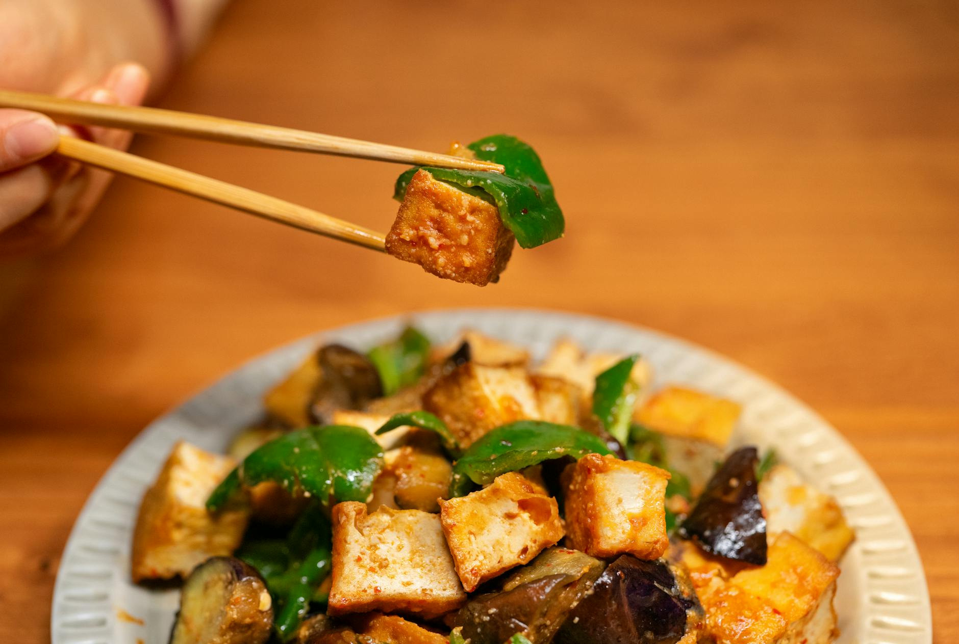 Hanoi Vegetarian Food Guide: 12 Best Vegan Restaurants (2026) 2 Vegan tofu stir fry with fresh vegetables in vibrant Asian style