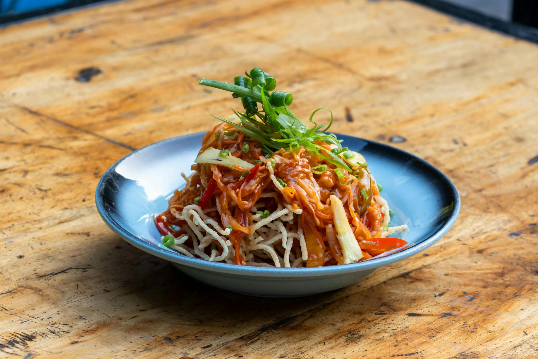Hanoi Vegetarian Food Guide: 12 Best Vegan Restaurants (2026) 3 Vibrant Asian noodle salad topped with fresh vegetables