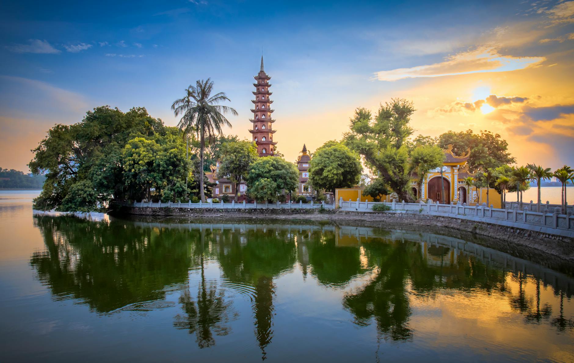Hanoi Vegetarian Food Guide: 12 Best Vegan Restaurants (2026) 5 Tran Quoc Pagoda reflecting on West Lake Hanoi