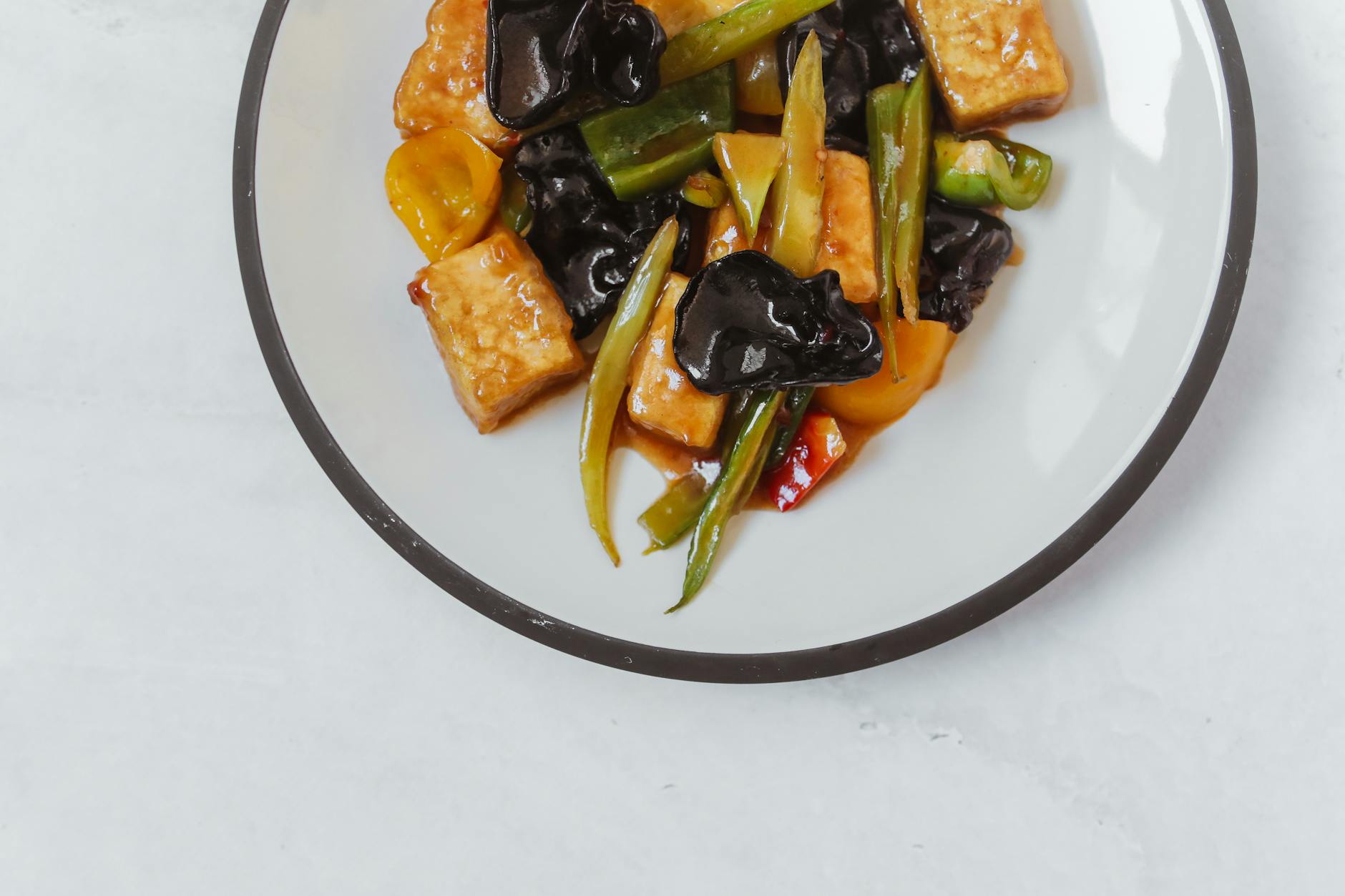 Hanoi Vegetarian Food Guide: 12 Best Vegan Restaurants (2026) 4 Top view of colorful Asian stir fry with tofu and vegetables
