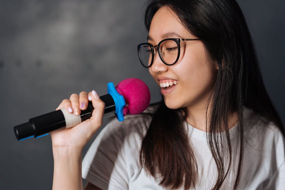 Young woman singing into microphone karaoke
