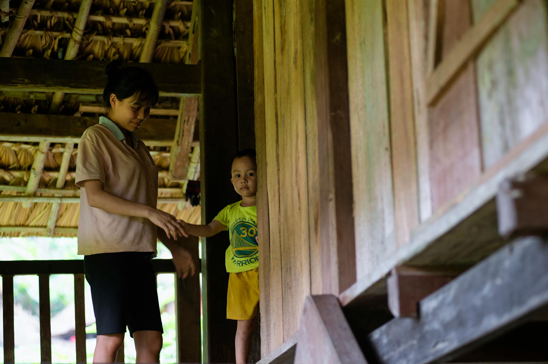 Mai Chau Day Trip from Hanoi: Valley & Activities (2026) 3 Heartwarming Vietnamese family in a traditional home