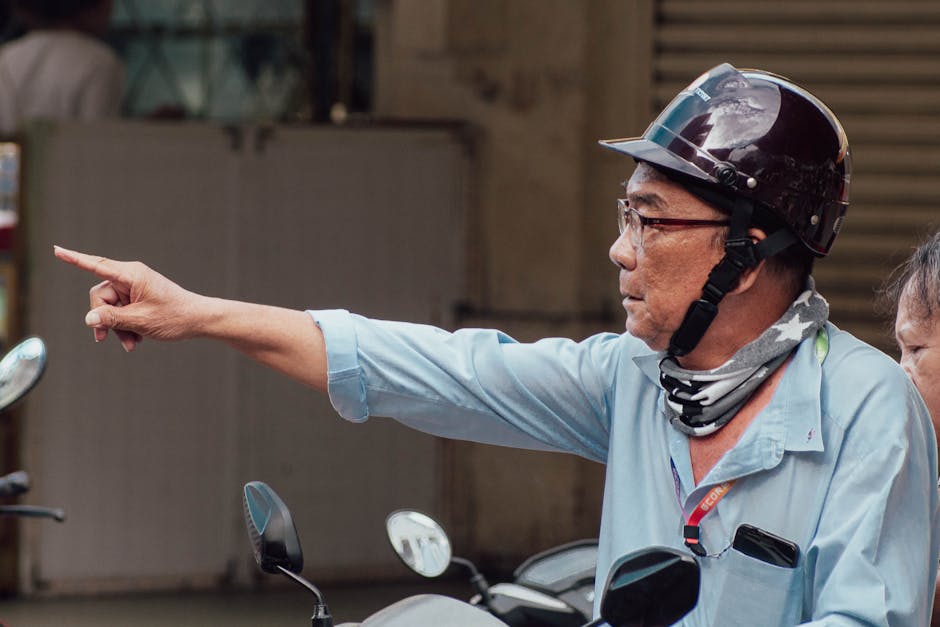 Asian man in helmet on motorbike in Vietnam