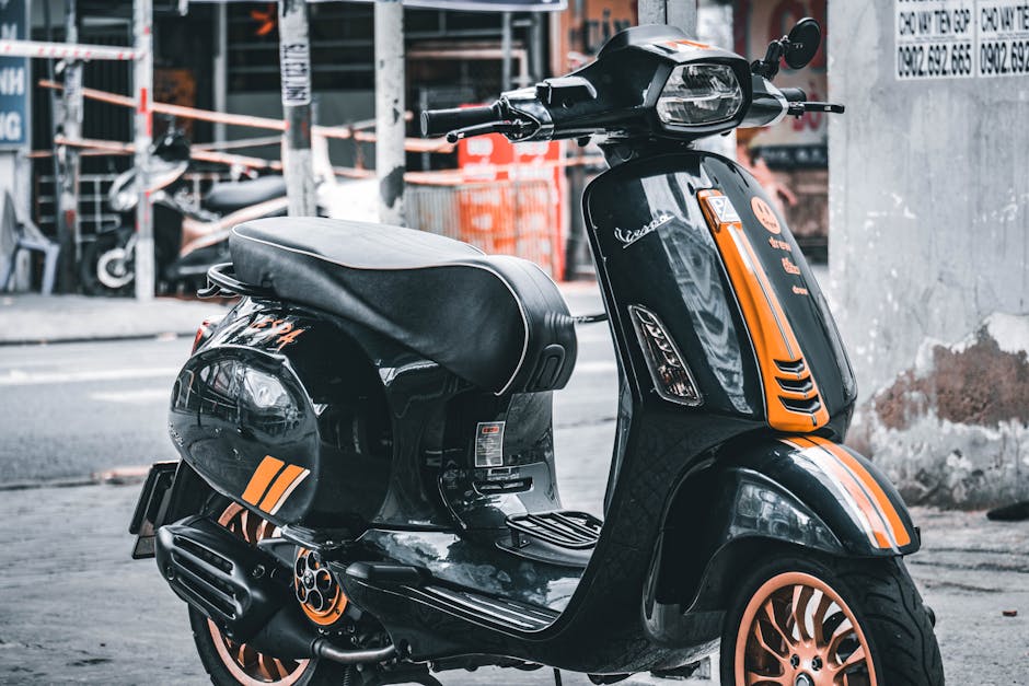 Black and orange scooter parked on street in Vietnam