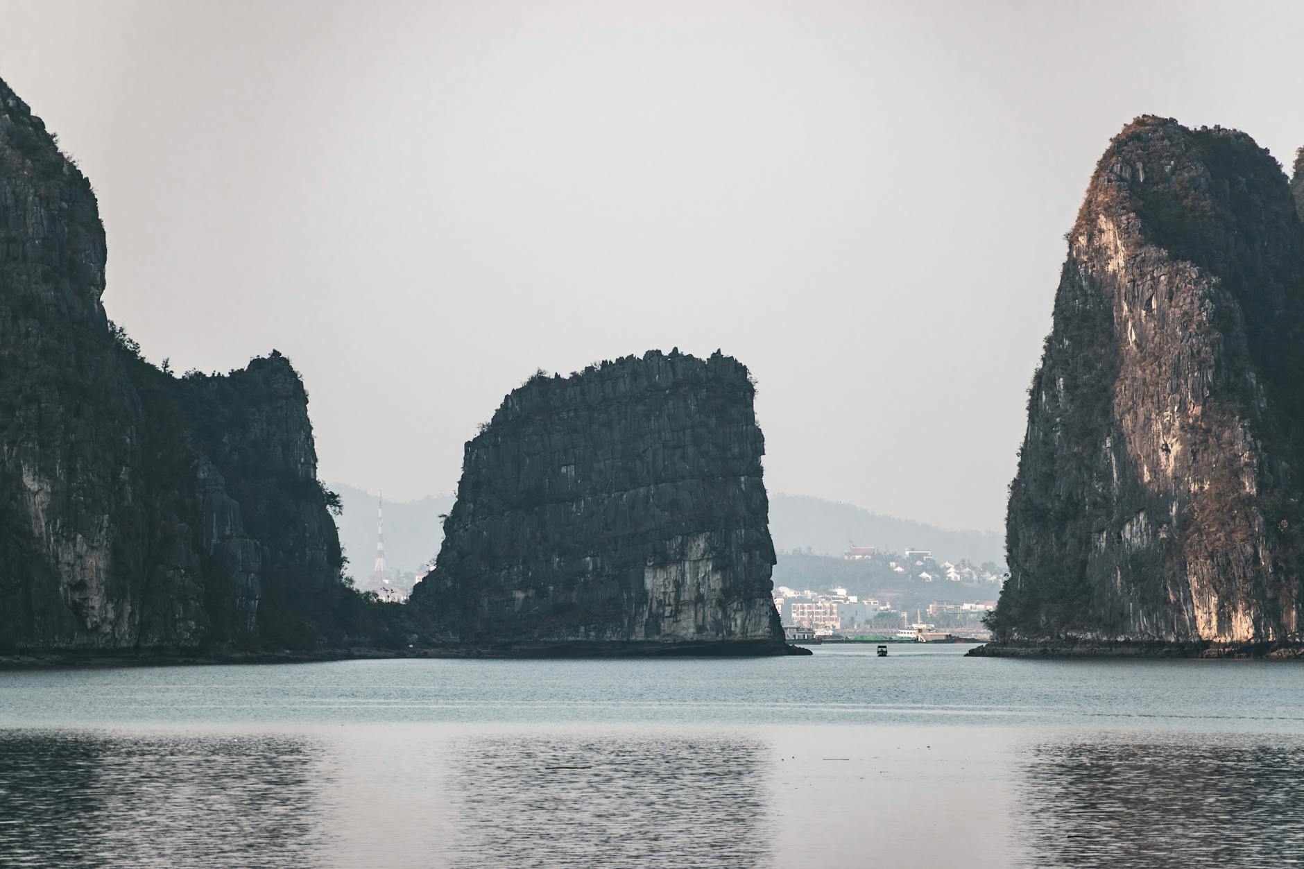 Ninh Binh Day Trip from Hanoi: Complete Guide (2026) 1 Tranquil scene of Ninh Binh limestone islands with calm waters