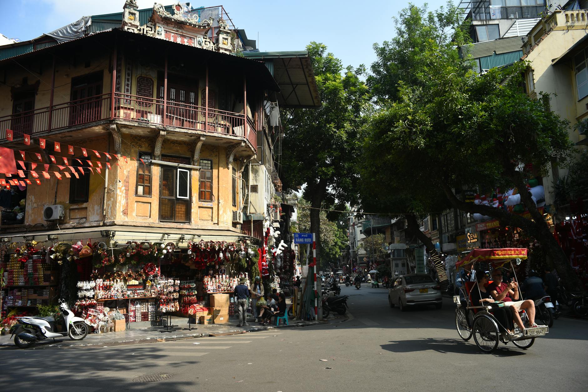 Lively Hanoi Old Quarter street with traditional architecture