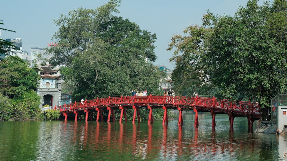 Hanoi Pagodas & Temples Guide: Sacred Sites (2026) 4 Red bridge over Hoan Kiem Lake to Ngoc Son Temple