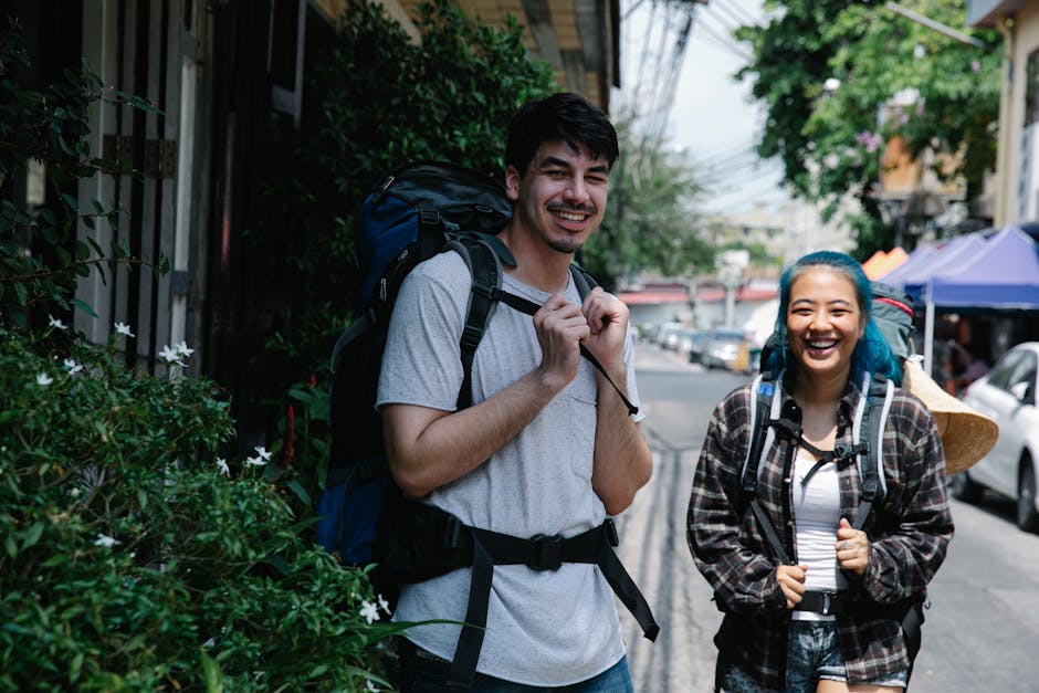 Hanoi Pub Crawls: Guided Nightlife Tour Guide (2026) 2 Two joyful backpackers on city street