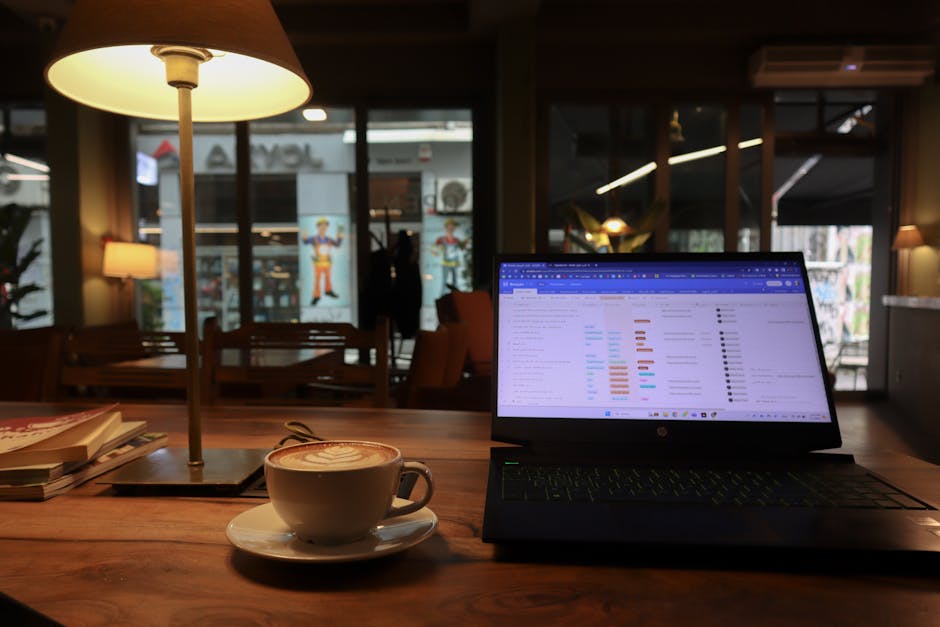 Hanoi SIM Card & WiFi Guide: Connectivity (2026) 3 Cafe scene with cappuccino and laptop