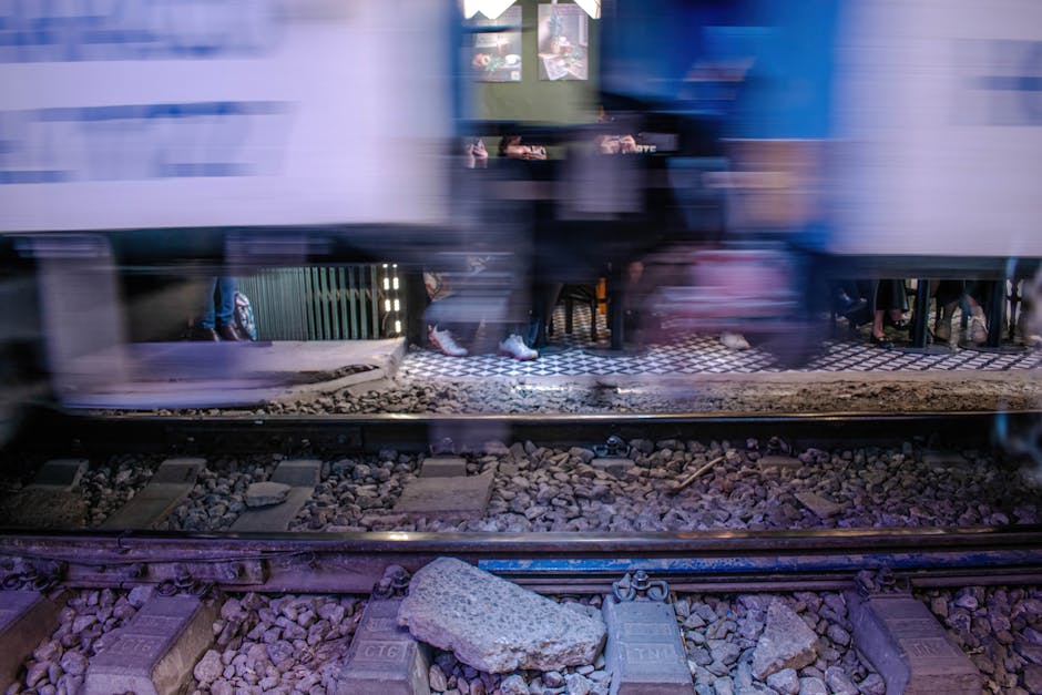 Blurred image of a train passing by pedestrian area Hanoi