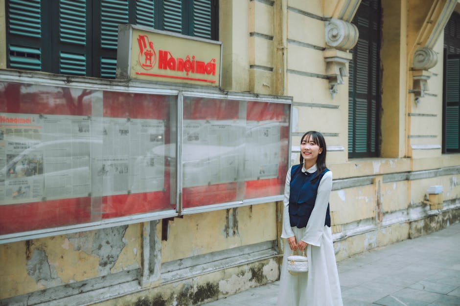 Hanoi for Women Travelers: Safety & Tips Guide (2026) 2 Smiling young woman in traditional dress in Hanoi